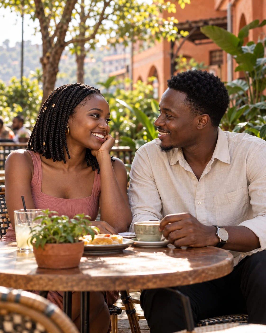 A couple sharing a smile on an outdoor café date